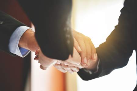 Business people Stacking Hands together. Unity and teamwork concept.の写真素材