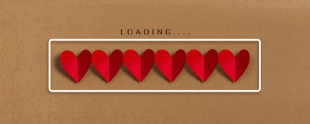 Loading progress bar with red hearts on brown paper background. Valentine's day, Love, Life...