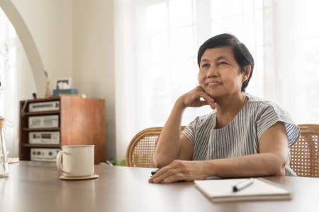 Portrait of Asian Mature woman with beautiful smile at home.の写真素材