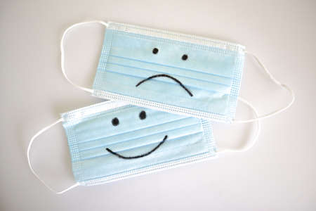 face masks smile happy and unhappyの写真素材