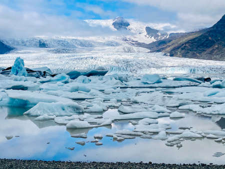 Jokulsarlon glacier lagoon with glacier mountains in the background, photographed in icelandの写真素材