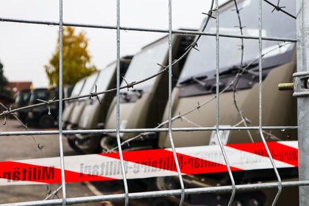 military trucks in cordoned-off area photographed in Langenthal, Switzerlandのeditorial素材