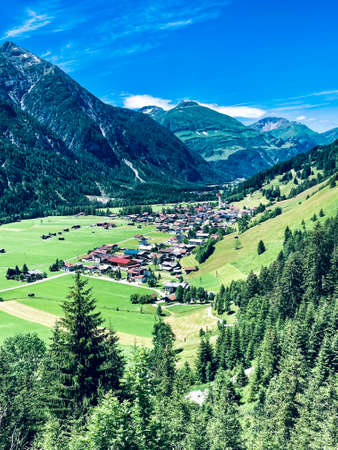 Vie on a Village in the Austrian Mountains on a sunny dayの写真素材