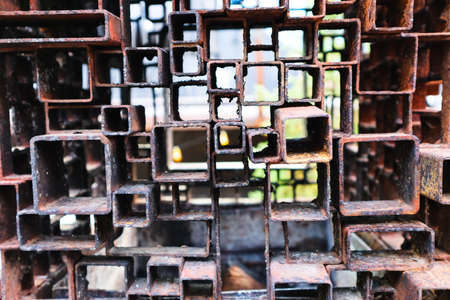 A lot of smaller and bigger rusty metal squares welded together