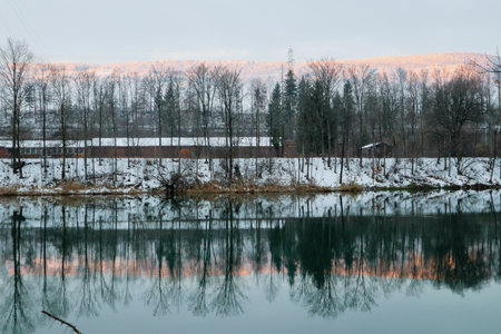 Wangen an der Aare, Switzerland, 12. December 2021: View to the Aare River with Reflection of the...
