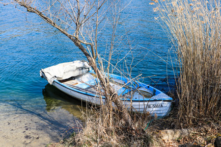Wangen an der Aare, Switzerland, 26. March 2022: A boat lying on the beach of the Aare riverのeditorial素材
