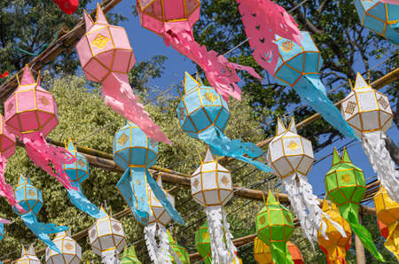 Picture of colorful lanterns for Loi Krathong festival hanging in a bamboo scaffoldの写真素材