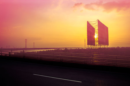 Sunset near the mekong river with billboards in the background
