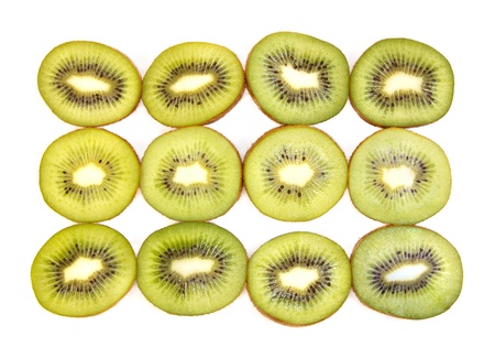 Half kiwi fruit on a row against white backgroundの写真素材