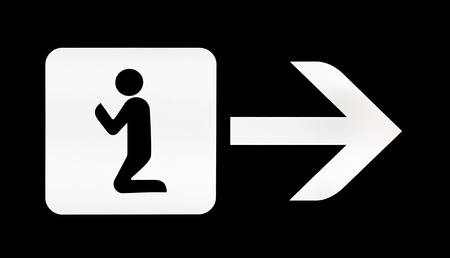 White illuminated sign with direction for prayer room on airportの写真素材