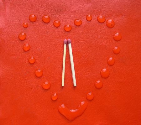 A heart from a water drops with a couple of matches insideの写真素材