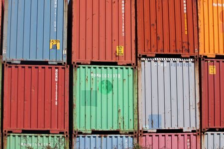 Stacked Cargo Containers at a Railroad Trackの写真素材