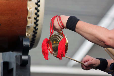 Closeup of a Taiko Drummer Playing Bellsの写真素材