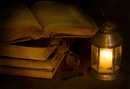 Open antique books the darkness of nightの写真素材