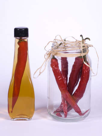 Flasks of Olive Oil and Red Chilli Peppers In Jar の写真素材