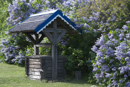 wintage well and lilacの写真素材