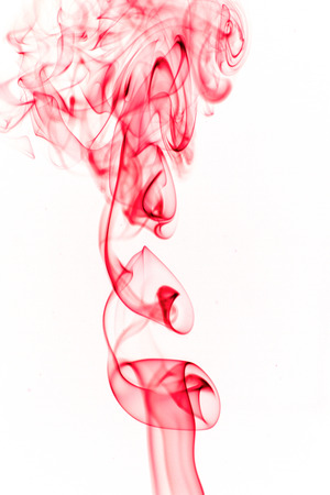 pink smoke on white background の写真素材