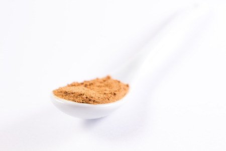 white spoon with guarana on a white backgroundの写真素材