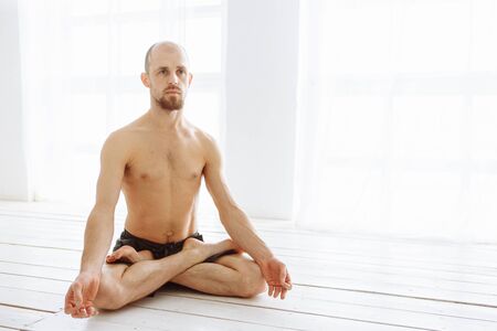 Man practicing advanced yoga. A series of yoga poses. Lifestyle conceptの写真素材