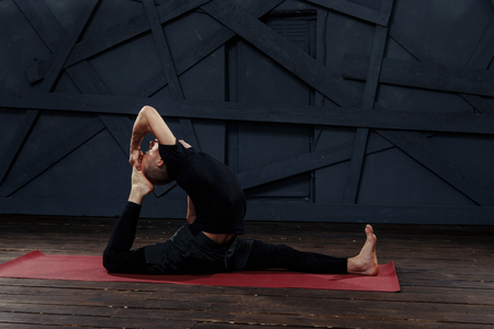 Man practicing advanced yoga. A series of yoga poses. Sport conceptの写真素材