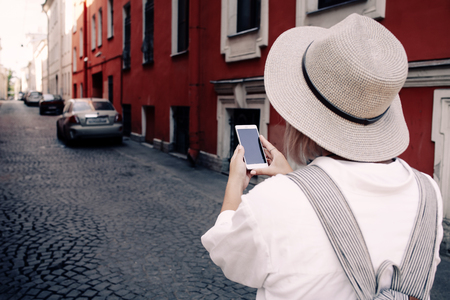 Tourist using navigation app on the mobile phone. Travel concept. Adventureの写真素材