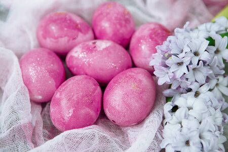 Colorful decorated easter eggs on gray plaster background. Happy Easter.の写真素材
