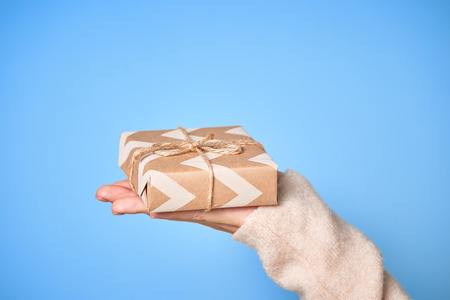 Gift boxes, Christmas decorations and pine cones on gray wooden table. Christmas background. Space for text. Top viewの写真素材