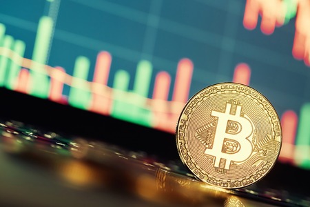 Bitcoins and New Virtual money concept.Gold bitcoins with Candle stick graph chart and digital...