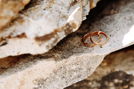 Wedding rings on the rock.の写真素材