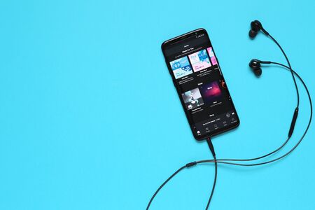 RUSSIA, Tyumen - February 10, 2018: Spotify application on mobile device Flat lay