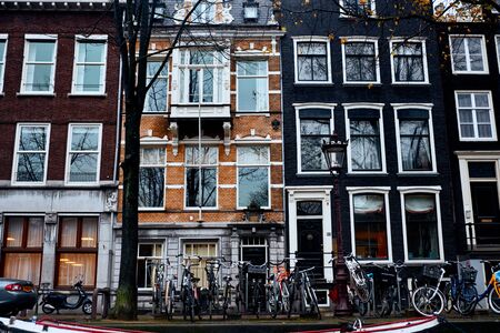 Amsterdam, Netherlands - November 22, 2017: The architecture of the historic center of Amsterdam along the canalsのeditorial素材