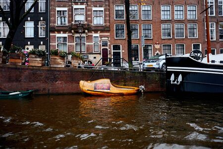 Amsterdam, Netherlands - November 22, 2017: Klompen boot moored on a canal in the center of Amsterdamのeditorial素材