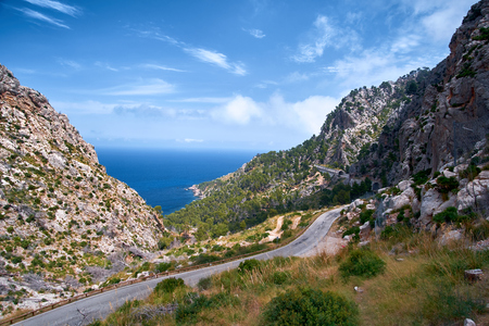 Beautiful picturesque winding road of Spain summer coast and Mediterranean sea with tunnel.の写真素材