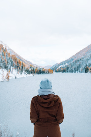 Winter landscape with lake. Beautiful landscape. Mountains covered by snowの写真素材