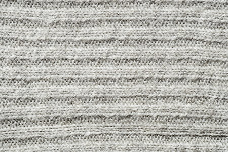 Texture of knitted fabric. Stranded threads. Cloth of warm winter clothesの写真素材