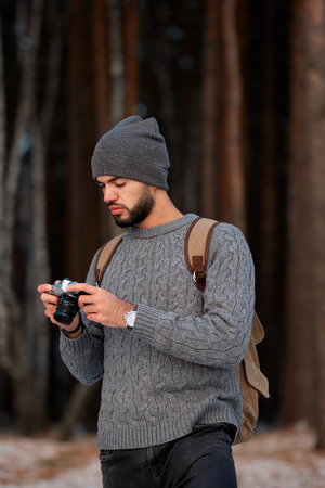 Professional nature photographer outdoor in the winter forestの写真素材