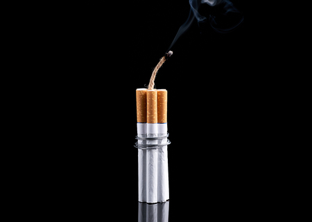 Dynamite made from cigarettes shows danger of smoking. Stop smoking concept.の写真素材