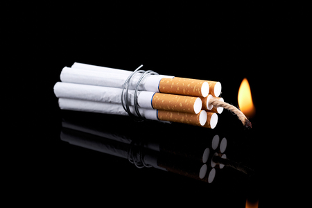 Dynamite made from cigarettes shows danger of smoking. Stop smoking concept.の写真素材