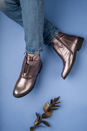 Girl showing shoes on her feet. Top view different colors. Fashion and beauty concept.の写真素材