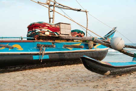 Old Fishing Boat on Sand Beach Indian Ocean. Blue Vessel Full of Fishman Equipment Ready to Sail....