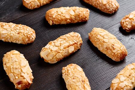 Almond Baked Cookie on Wooden Table Background. Sweet Healthy Homemade Vegan Vegetarian Pastry with Nuts Chip. Delicious Crunchy Bakery Biscuit Cake Dessert. Crispy Confectionery Breakfastの写真素材