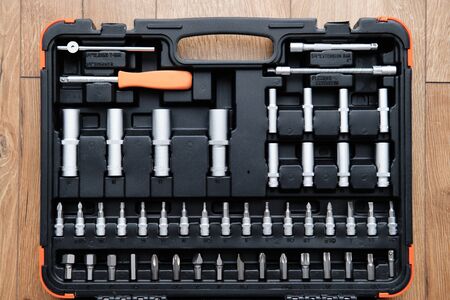 Tool Kit for the Car. Set of Tools for Repair on Wooden background. Repair and maintenance concept