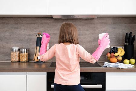 Preschool Girl doing Cleaning Kitchen. House cleaningの写真素材