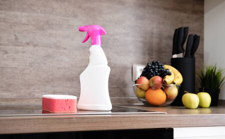 Detergents and cleaning accessories on kitchen. Cleaning and Washing Kitchen. Cleaning service conceptの写真素材