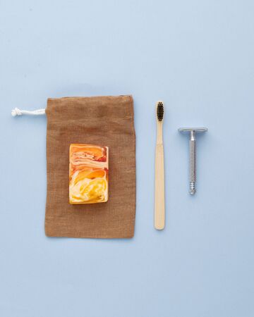Toothbrush Retro Metallic Shaver Empty Brown Pouch and Decorative Yellow Orange Soap Isolated on...