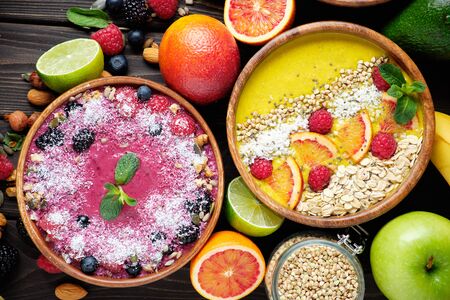 Smoothie bowls. Healthy breakfast bowl with chia seeds, muesli, berries, fruits and coconut flakes coconut flakes. Vegan food.の写真素材