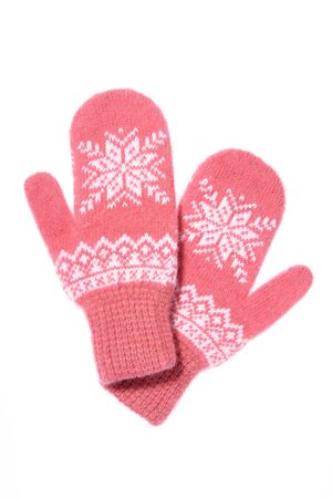 Warm woolen knitted mittens isolated on white background. Pink kの写真素材