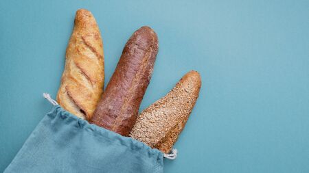Fresh bread and baguette in cotton bag. Bakery Products. Friendlの写真素材