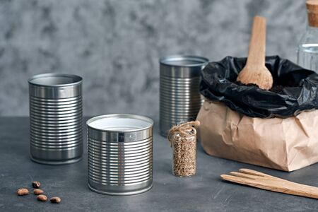 Sowing seeds in metal cans. Zero waste.