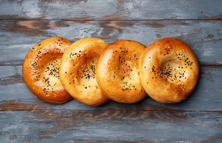 National uzbek bread on wood background. Traditional food. Top viewの写真素材